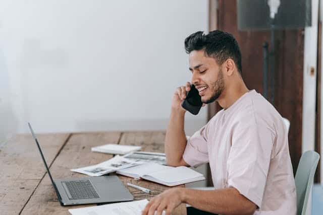 businessman using 01204 area code number from air landline